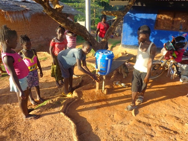 children washing hands after being shown how to by CARE[1].JPG